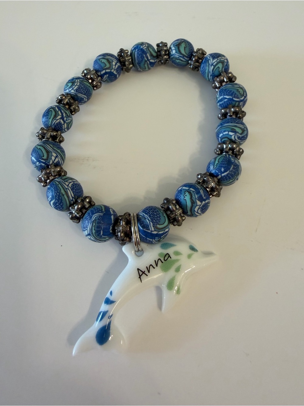 Blue Swirl Beaded stone Stretch Bracelet with Dolphin Charm ( can be removed)